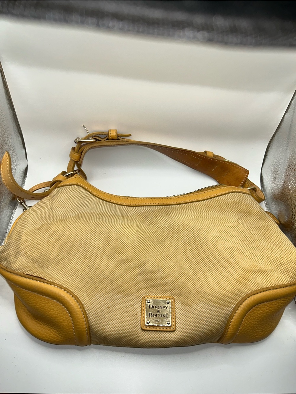 Dooney & Bourke tan canvas and leather shoulder bag